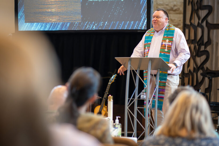 Pastor Mike Zdorow delivering a sermon message to congregation at The Gathering Place