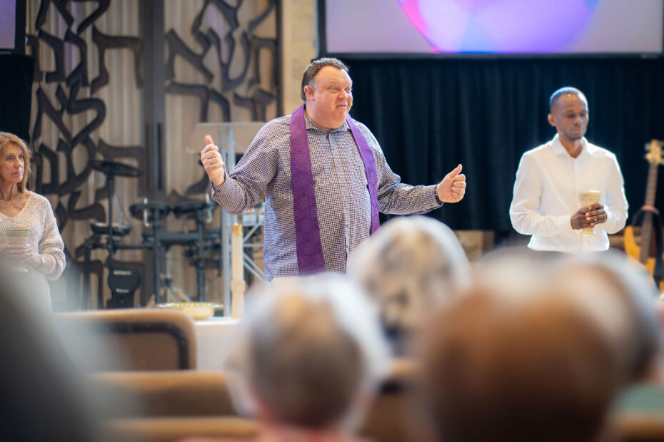 Pastor Mike Zdorow delivering a Sunday message to an engaged audience at The Gathering Place Church in Palm Beach Gardens